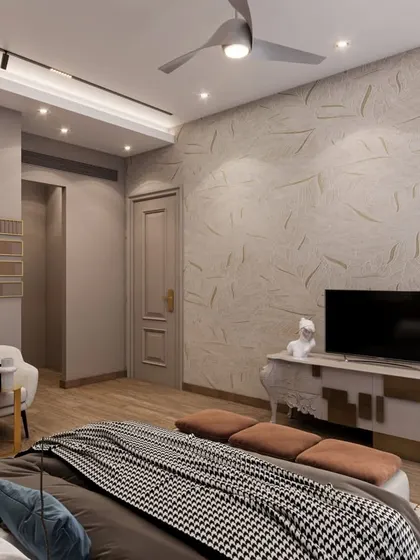 The TV wall of the Amaryllis bedroom, showcasing a textured wallpaper with gold accents and a classic-style console. The design is both luxurious and functional.