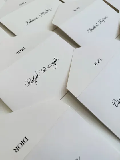 Another angle of the Dior envelopes, showing the beautiful script and consistency across a large order for a major brand event.