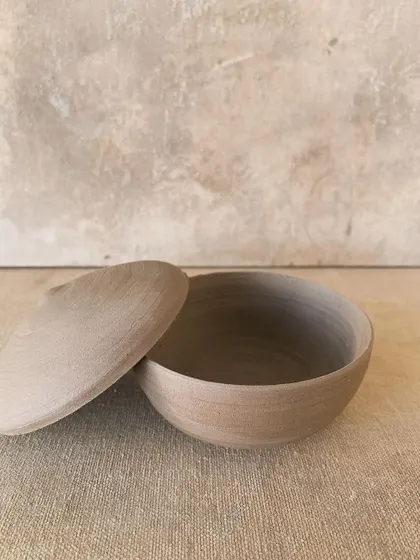 A raw, unglazed lidded jar, wheel-thrown and trimmed to perfection. I love the simplicity of these forms, where the beauty of the natural clay is the main focus.