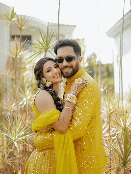 A sweet portrait of the couple, coordinated in yellow, ready for their fun-filled Haldi ceremony in Goa.