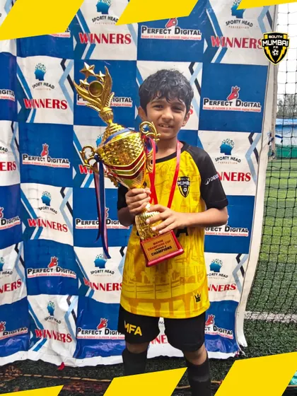 Another one of our U8 champions, beaming with pride. Individual confidence is built through collective success.