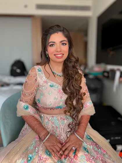 Another shot of this pastel reception look. The makeup is fresh and modern, perfect for a younger bride.