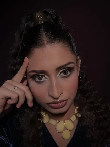 A thoughtful pose that draws attention to the eyes, the focal point of this HD makeup look.