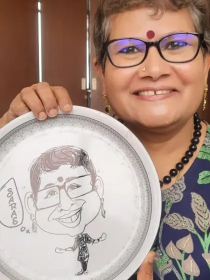 We offer unique entertainment like live caricature artists who create fun, personalized keepsakes for your guests. This happy client is showing off her caricature drawn on a plate, a fantastic party favor.