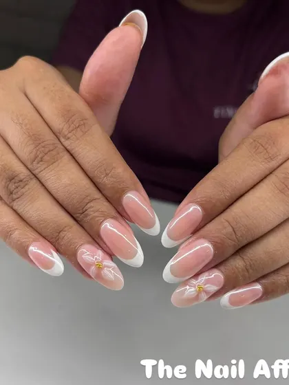 A classic almond-shaped French manicure with a twist. We added delicate, hand-painted 3D flowers for a subtle, elegant detail.