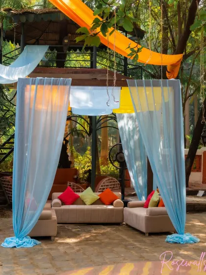 Another view of the semi-private cabana seating, perfect for guests to chat and relax in a beautifully decorated space.