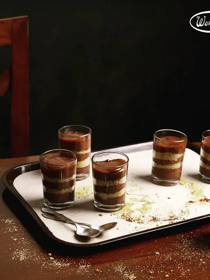 Our chocolate verrines, a layered dessert served in a glass. This elegant treat combines different textures and flavours of chocolate for a delightful experience.