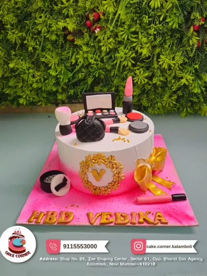 A glamorous makeup-themed cake for Vedika's birthday. It's adorned with edible lipstick, eyeshadow palettes, and brushes, perfect for a beauty queen.