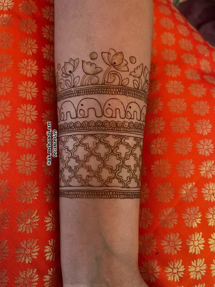 This is the outline stage of the elephant and lotus band design. My classes emphasize the importance of a perfect outline before starting the detailed filling work.