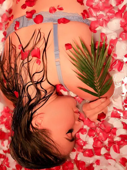 Another artistic angle from the milk bath session. The contrast of the green leaf against the red petals adds a beautiful, unexpected element to the composition.