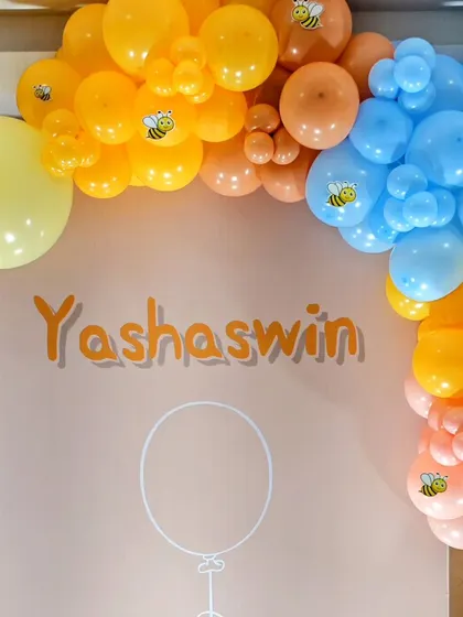 A personalized backdrop for Yashaswin's honeybee party.