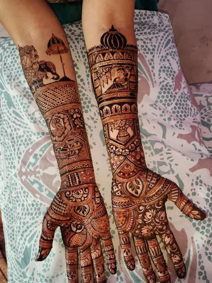 Your story, told in henna. This custom bridal design features a traditional doli (palanquin) scene, majestic elephants, and sacred kalash motifs, making the mehndi truly personal and unique to the bride's journey.