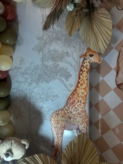 A detailed view of the cute giraffe prop used in the Vedhansh naming ceremony decor, highlighting our attention to creating a cohesive and charming theme.