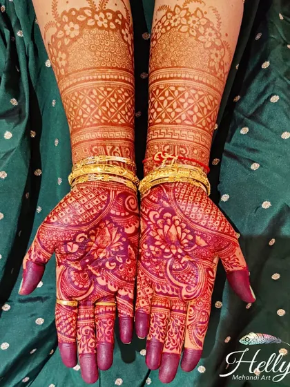 A breathtakingly dark and rich henna stain on a bride. The deep burgundy color makes every intricate detail of the design pop, creating a truly luxurious and stunning final look.