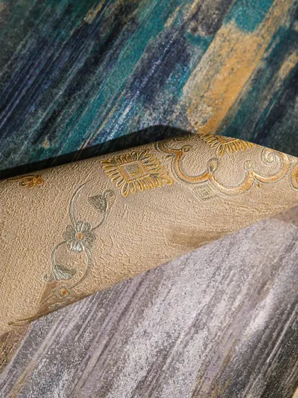 A beautiful assortment of wallpaper samples. This image highlights the rich colors and textures available in our collection, from deep teals and beiges to classic damask patterns.