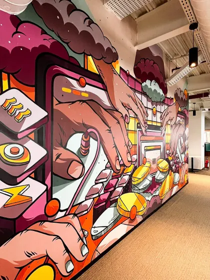An angled view of the engineering mural, showing its depth and vibrant color palette.