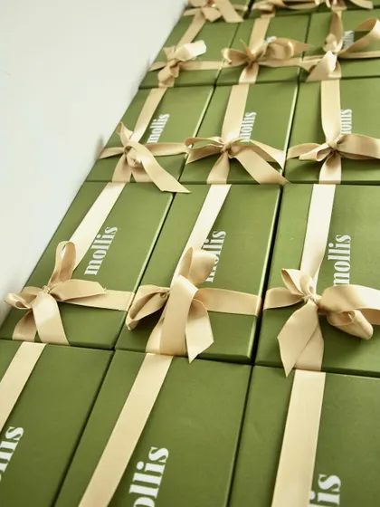 Another angle of the elegant green and gold Rakhi gift boxes.