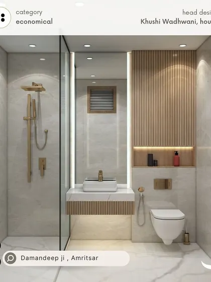 An economical yet stylish bathroom for Damandeep in Amritsar. This design uses a combination of light-colored tiles and wood-textured panels to create a warm and inviting space.