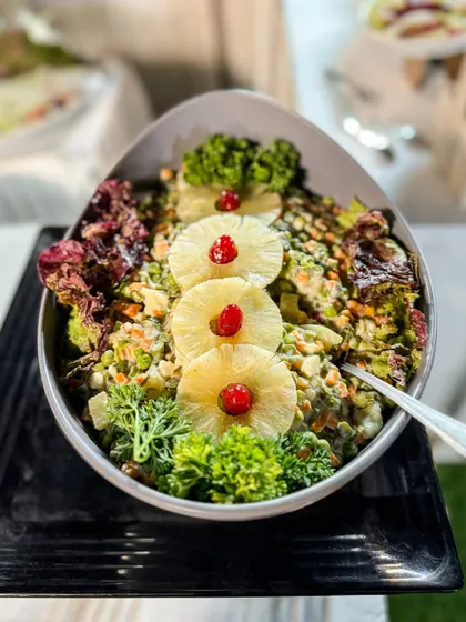 A beautifully presented pineapple and broccoli salad. We believe that even salads should be a work of art, combining fresh ingredients, vibrant colours, and delicious dressings.