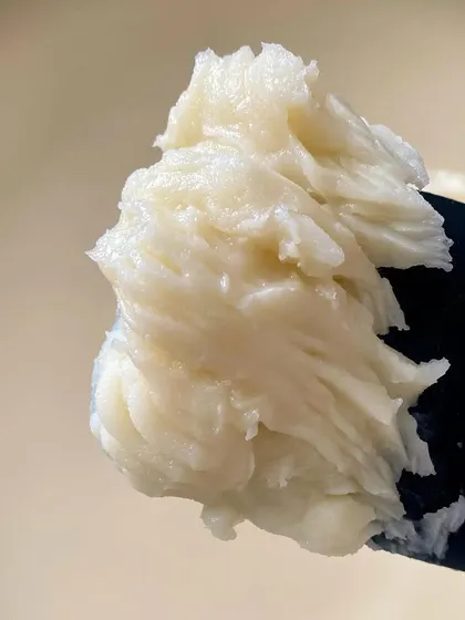 A texture shot of our body butter before it's whipped. We believe skincare is an art form, and texture is a huge part of the sensory experience.