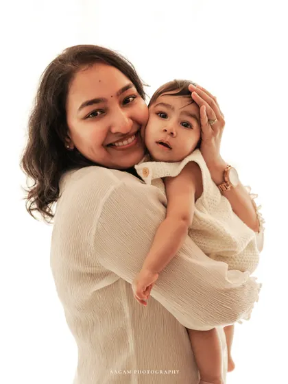 A mother's warm embrace. This close-up shot beautifully captures the love and affection between a mom and her baby.