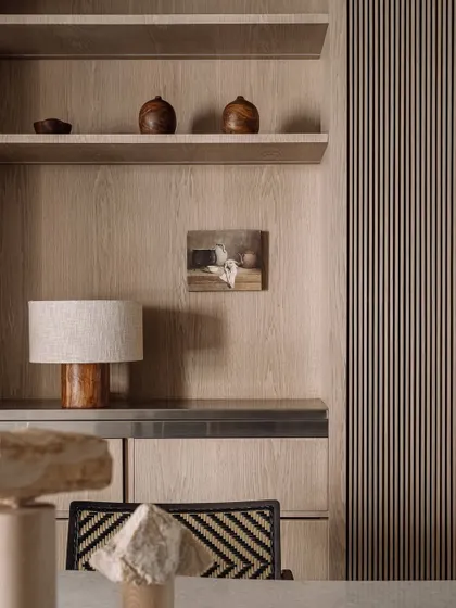 A moody detail shot showing the texture of the wood and the soft, diffused light. It’s these quiet compositions that give Kanso House its soul.