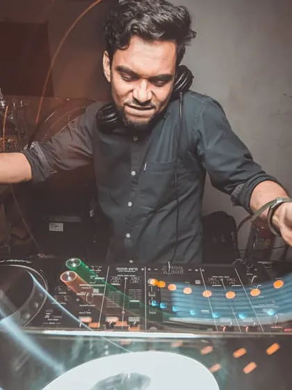 In the zone, crafting the perfect mix. This shot captures the focus and passion that goes into every set I play, blending tracks to create a seamless musical journey.