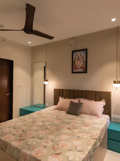 This view highlights the bedside setup with hanging pendant lights, which saves space on the nightstands. The design is clean, functional, and perfect for a modern home.
