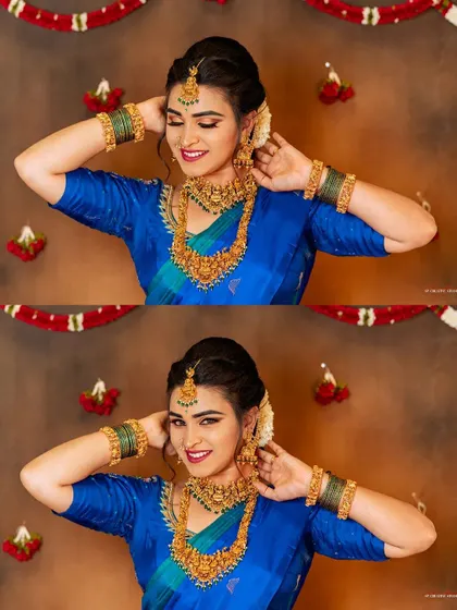 A happy and radiant portrait of a model in a beautiful blue Kanjeevaram saree.