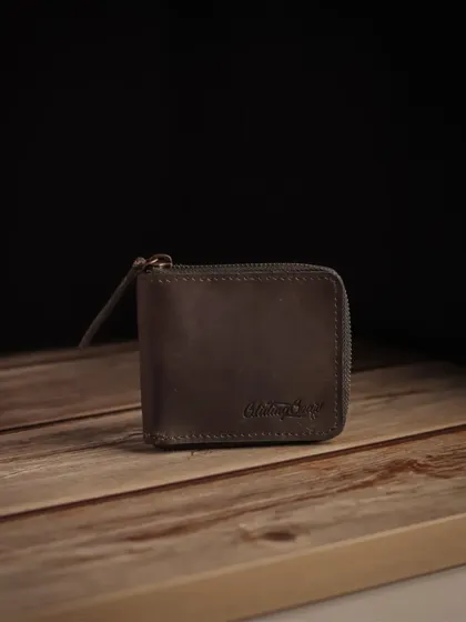 A product shot for a Glidinggear leather wallet. I used a rustic wooden background and focused lighting to emphasize the wallet's craftsmanship and durable material.