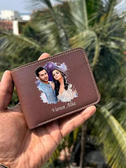 The brown Saffiona wallet, featuring a custom couple's photo and name.
