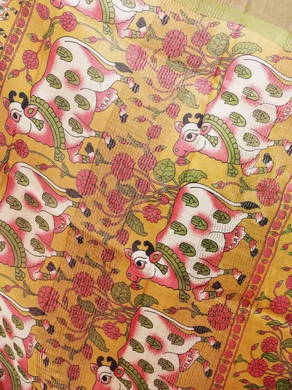 A close-up of the Kamadhenu (holy cow) motif, a central element of Pichwai art.