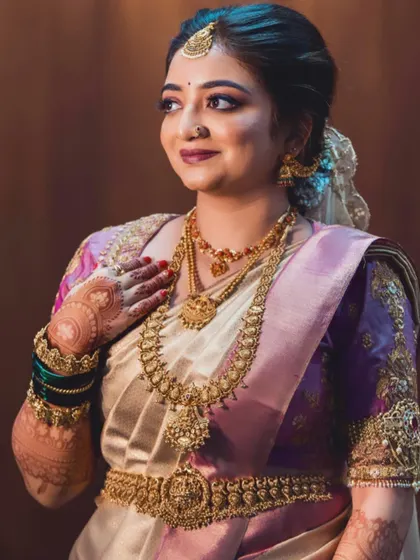 Aishwarya looked stunning for her wedding ceremony. This candid shot captures her glowing skin and the intricate details of her henna.