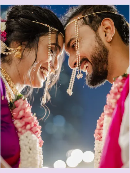 A close-up of the couple, nose-to-nose, sharing an intimate, happy moment.