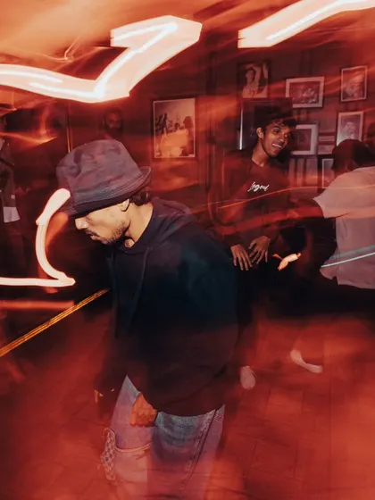 The dance floor in full swing. The motion blur captures the wild energy of the night.