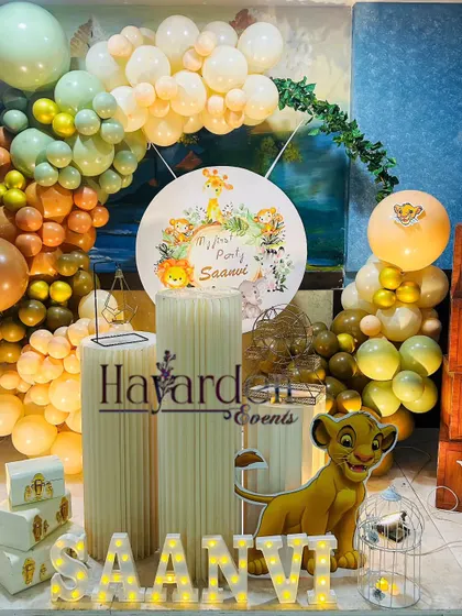 A gentle and sweet Lion King theme for a first birthday. I used a soft, earthy color palette for the balloons and a custom backdrop featuring Simba.