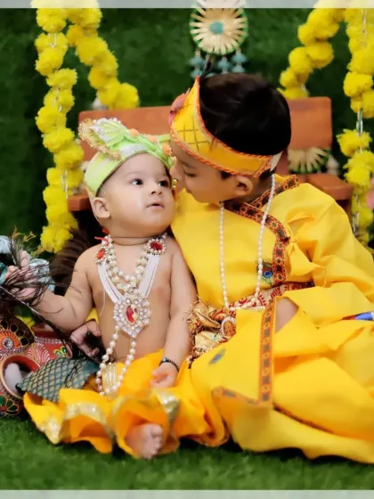 A heartwarming photo of two brothers dressed as Krishna. Our sibling photoshoots are designed to capture the unique bond and playful interactions between your children.