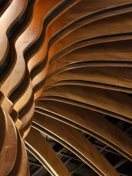 This detail of a parametrically designed wooden installation at the Nishtara Banquet Hall shows our exploration of form and material. The flowing, rhythmic curves are a testament to our commitment to pushing the boundaries of craftsmanship and design.