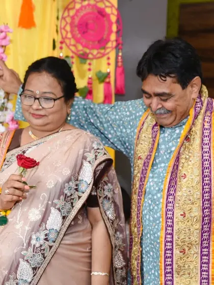 A couple enjoying a dance at the party, a candid moment of celebration and fun.