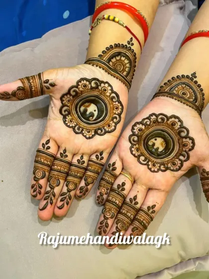 A beautiful mandala design for the center of the palm. This style is traditional for festivals and family functions, featuring a central elephant motif for good luck.