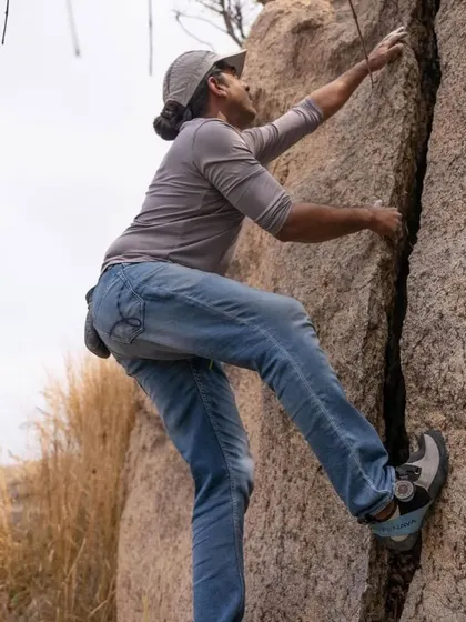 Yogi focused on a crack climb. His story of starting climbing to overcome a fear of heights is an inspiration to many in our community.