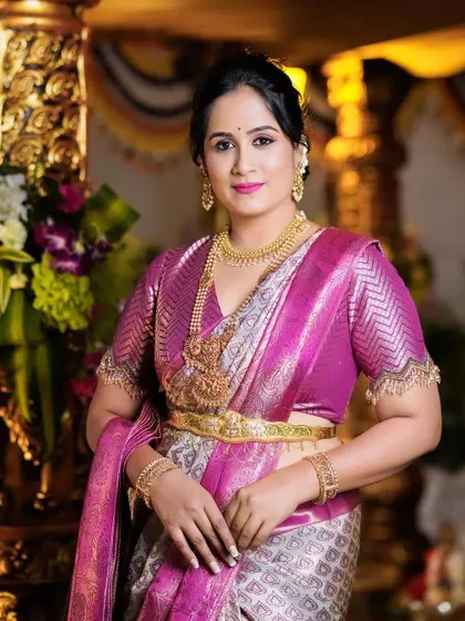A classic portrait of Hemalatha. The detailed blouse and the heavy jewelry complement the luxurious saree perfectly.