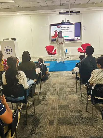 Presenting on the topic of Mindfulness Meditation to a corporate audience at British Telecom, with a clear presentation slide.