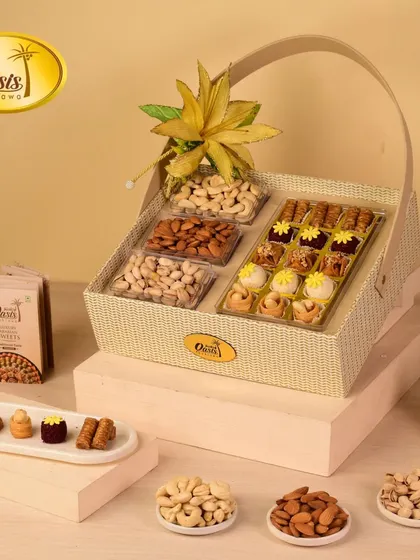This charming hamper basket combines the best of both worlds. It includes a section of my finest baklava and fusion sweets alongside compartments of premium almonds, pistachios, and cashews.