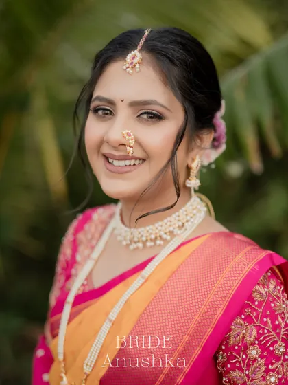 A beautiful close-up headshot of the bride, her happy smile and traditional nose ring being the focus.