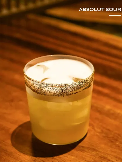 The Absolut Sour, a classic sour with a poppy seed rim for texture.