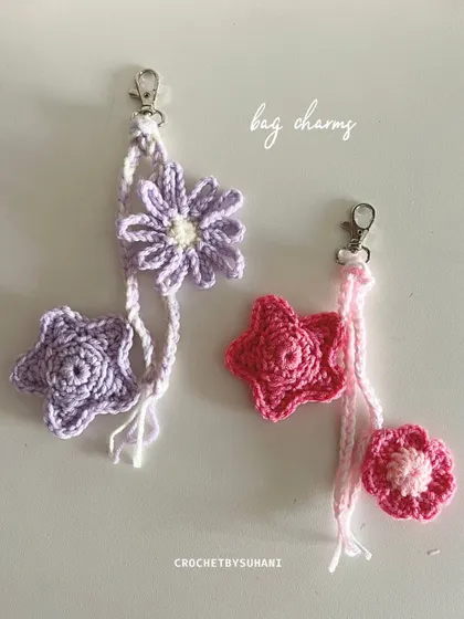 A beautiful combination of my floral and star designs. These bag charms feature a braided hanger and are shown in coordinating lavender and pink colorways.