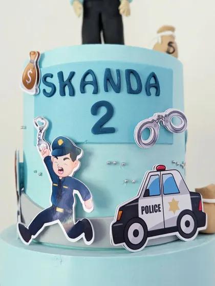 A detailed shot of the side of the cake, showing the playful cutouts.