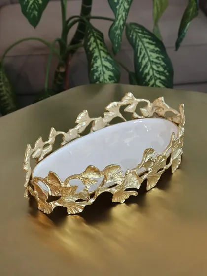 The exquisite ginkgo leaf platter, crafted from gold-finished metal with a white enamel base. It’s a sculptural and functional piece, perfect for serving appetizers or as a standalone decorative object.
