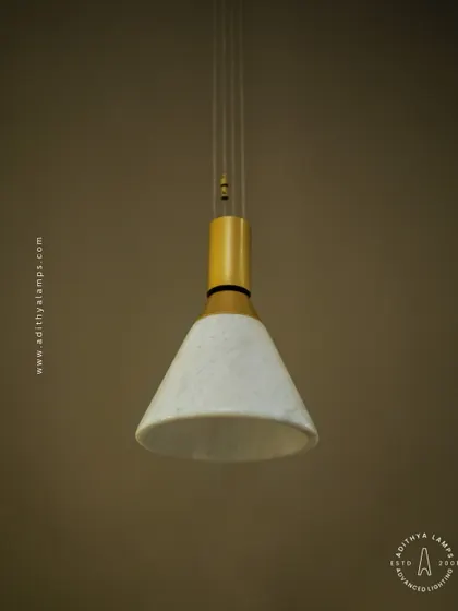 A simple yet elegant cone-shaped pendant light. The shade is crafted from marble, providing a warm, diffused downlight that is perfect for task lighting over kitchen counters, reading nooks, or as accent lighting.